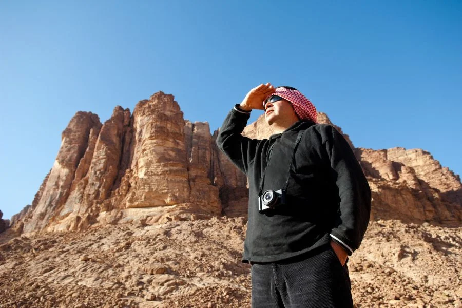 Climbing over the rocks in Jordan's Wadi Rum